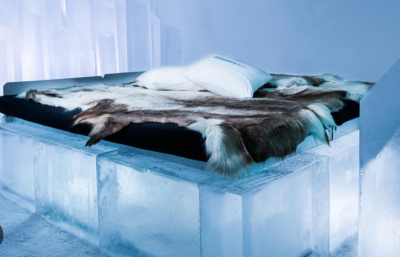 Image shows a bed made from a block of ice.
